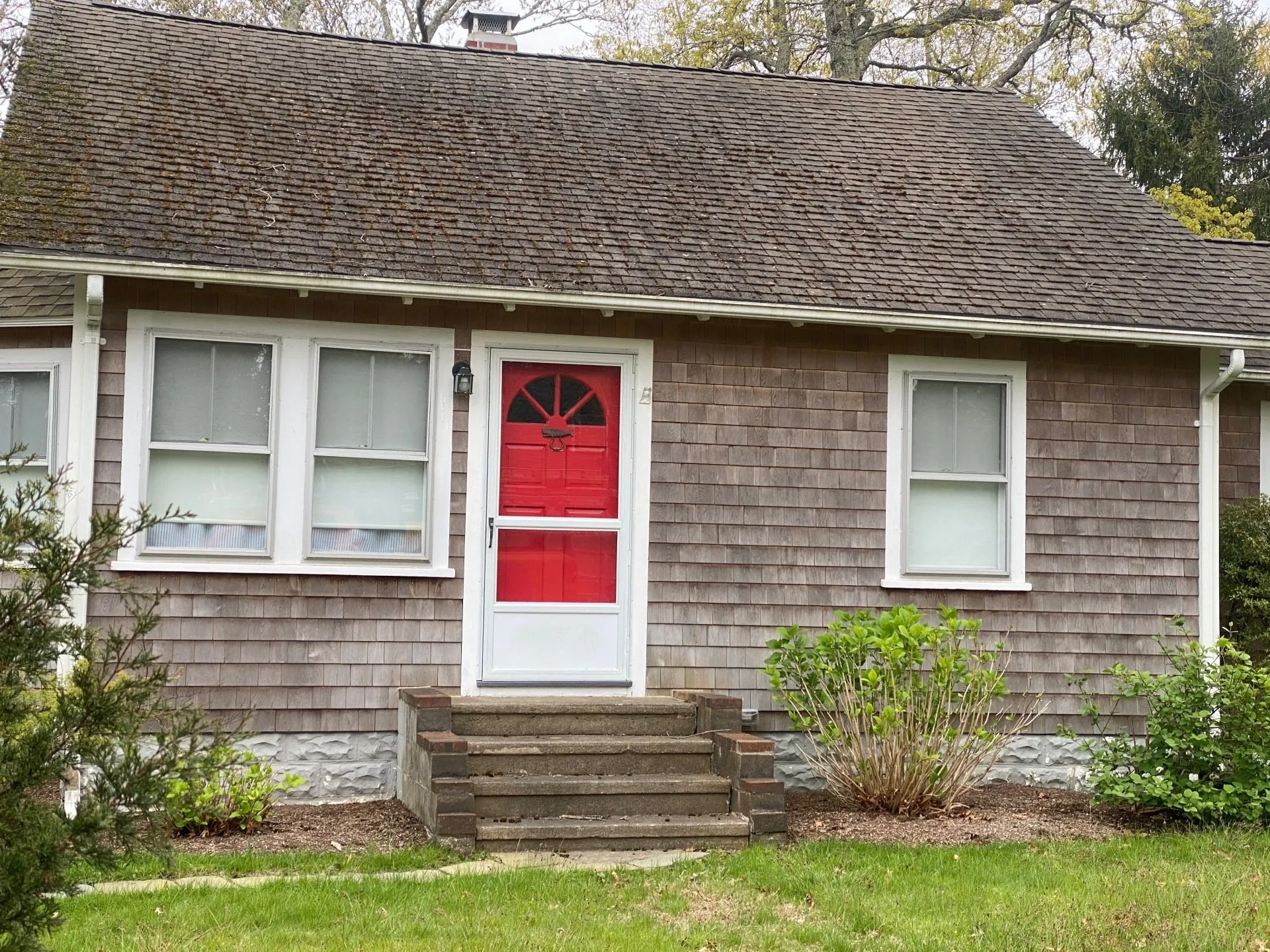 Weathered home exterior before cleaning